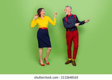 Full Body Photo Of Cheerful Excited Two People Enjoy 60s Discotheque Holiday Isolated On Green Color Background