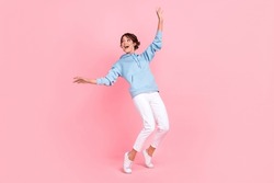 Full Body Photo Of Cheerful Lady Dressed Stylish Blue Clothes Stand Toes Interested Look Empty Space Isolated On Pink Color Background