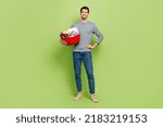 Full body photo of cheerful reliable husband helping wife cleaning home isolated on green color background