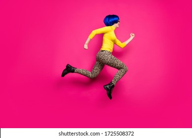 Full body photo of cool lady jumping high rushing discount shopping wear yellow turtleneck blue short wig boots leopard trousers isolated bright pink color background