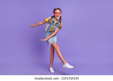 Full Body Photo Of Cool School Blond Girl Dance Wear Eyewear T-shirt Jeans Vest Skirt Boots Isolated On Violet Background