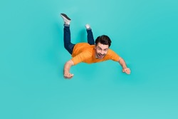 Full Body Photo Of Crazy Guy Playing Air Gliding Flying Isolated On Cyan Color Background