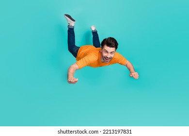 Full Body Photo Of Crazy Guy Playing Air Gliding Flying Isolated On Cyan Color Background