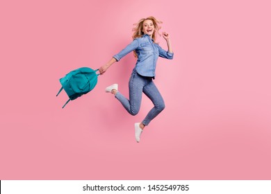 Full body photo of crazy lady glad classes end jumping high wear denim outfit isolated pink background