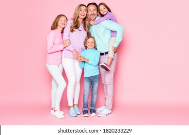 Full Body Photo Of Dream Harmony Big Family Enjoy Spend Time Together Daddy Piggyback Hug His Younger Daughter Mom Laughing With Kids Isolated Over Pastel Color Background