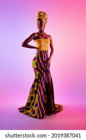 Full body photo dreamy young dark skin woman look empty space wear tribal dress isolated glow effect background