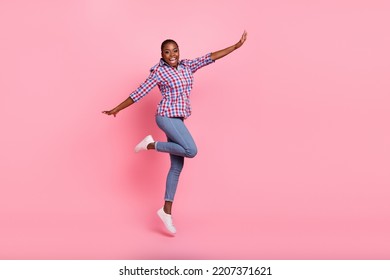 Full body photo of energetic cheerful lady jumping enjoy good mood isolated on pink color background - Shutterstock ID 2207371621