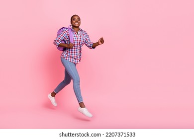 Full body photo of excited sportive lady running jump empty space isolated on pink color background - Shutterstock ID 2207371533