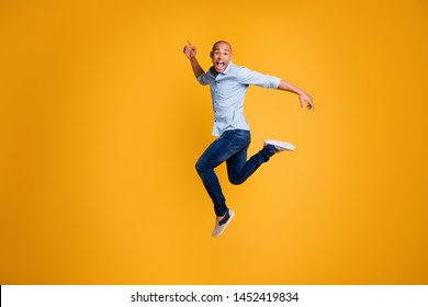 Full body photo of funky man feel content careless isolated over yellow background - Shutterstock ID 1452419834