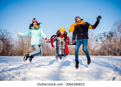 Full body photo of funny lovely family jump wear winter cloth outside walk in park