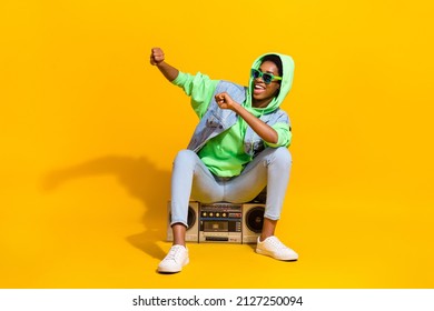 Full Body Photo Of Funny Youngster Sitting Boom Box Enjoy Have Fun Isolated On Yellow Color Background