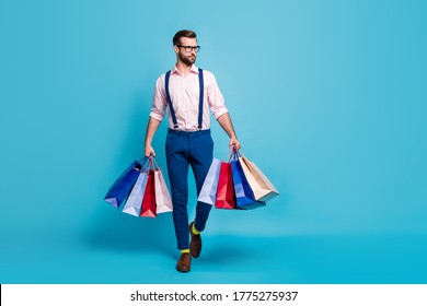 Full Body Photo Of Handsome Business Man Worker Carry Many Bags Buy Clothes Vacation Shopping Center Wear Specs Shirt Suspenders Pants Boots Socks Isolated Pastel Blue Color Background