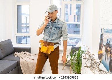 Full Body Photo Of Handsome Guy Master Answering Client Call Listening New Order Friendly Attentive Foreman Own Wooden Business Industry Woodwork Shop Garage Indoors.