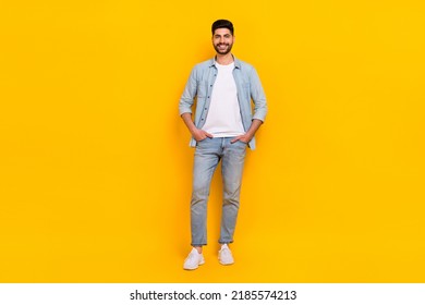 Full body photo of handsome hispanic young man toothy beaming clothes poster dressed trendy jeans look isolated on yellow color background - Powered by Shutterstock