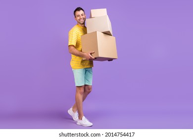 Full Body Photo Of Happy Cheerful Man Hold Hand Boxes Smile Move Houses Isolated On Purple Color Background