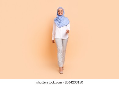 Full Body Photo Of Millennial Arabic Modern Lady Go Wear Headscarf Shirt Eyewear Pants Stilettos Isolated On Peach Background