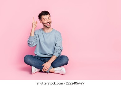 Full body photo of nice young man pointing finger up have great business idea wear stylish blue clothes isolated on pink color background - Powered by Shutterstock