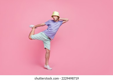 Full body photo of nice young guy crazy dance battle perform empty space dressed trendy blue clothes isolated on pink color background