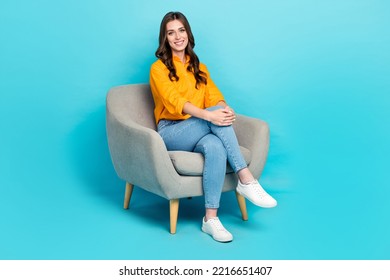 Full body photo of positive pretty girl sit chair toothy smile good mood isolated on blue color background