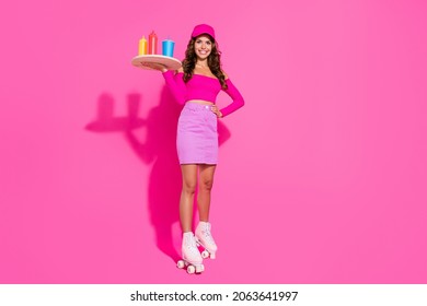 Full body photo of pretty cheerful girl hold tray toothy smile look camera isolated on magenta bright pink color background - Powered by Shutterstock