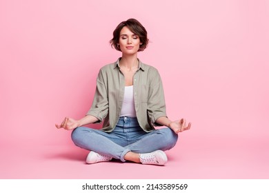 Full body photo of pretty focused lady sit lotus position meditate mudra fingers isolated over pastel color background - Shutterstock ID 2143589569