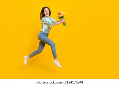Full body photo of running attractive girl give mom present on birthday woman day isolated on yellow color background