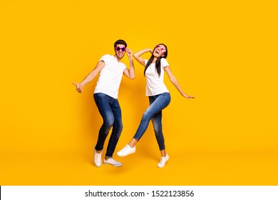 Full Body Photo Of Two People Dancing At First Season Theme Party Wear Cool Specs And Casual Clothes Isolated Yellow Color Background