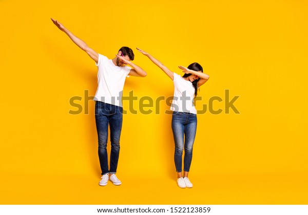 Full
body photo of two people dancing at theme party cool modern moves
wear casual clothes isolated yellow color
background