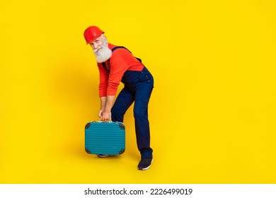 Full body photo of weak retired technician hold heavy tool kit box isolated on bright color background - Powered by Shutterstock