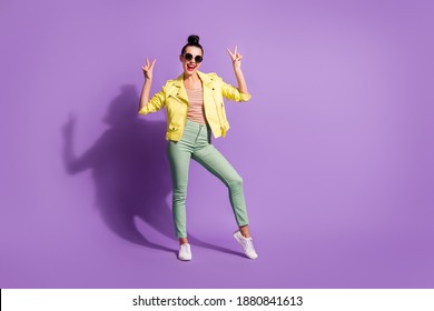 Full body photo of young beautiful girl show gesture cool peace victory sign isolated over violet color background