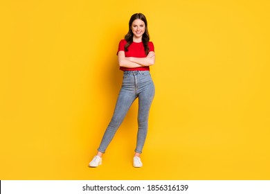 Full body photo of young business lady wear red t-shirt cropped top jeans shoes isolated yellow color background