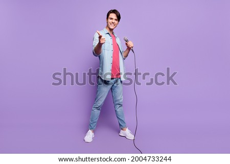 Full body photo of young man happy positive smile point finger you choice star stage singer isolated over purple color background