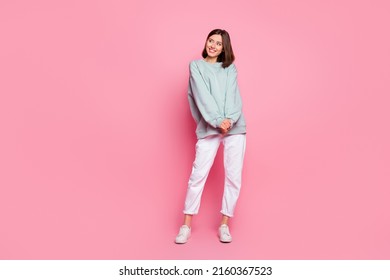 Full body photo of young pretty lady wonder look empty space modern outfit isolated over pink color background