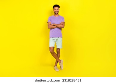 Full body photo of young satisfied smiling guy crossed arms wear trendy outfit confident looking you isolated over yellow color background - Powered by Shutterstock