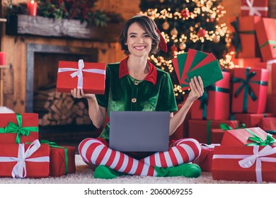 Full Body Photo Of Young Woman Elf Santa Helper Hold Hands Gift Letter Laptop Sit Floor Christmas Indoors Inside House Home