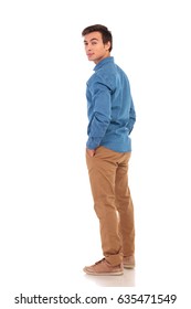 Full Body Picture Of A Casual Man Looking Back Over His Shoulder On White Background, Back View