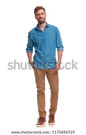 full body picture of a casual man with hand in pocket on white background