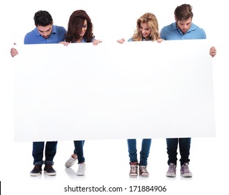 Full Body Picture Of Casual People Holding And Looking At A Blank Board On White Background