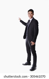 Full Body Picture Of A Happy Business Man Presenting Something On A White Background