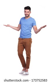full body picture of a young casual man welcoming you with hands open