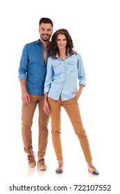 Full Body Picture Of Young Casual Couple Standing And Smiling Together On White Background