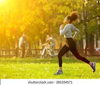 Full Body Portrait Of An African American Woman Running Outdoors