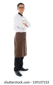 Full Body Portrait Of Confident Asian Chef Arms Crossed, Smiling And Standing Isolated On White Background.