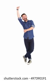 Full Body Portrait Of Excited Mature Man Standing With Arm Raised Over White Background