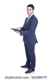 Full Body Portrait Of A Handsome Business Man Using A Tablet Pc, Isolated On White