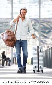 Full Body Portrait Of Happy Travel Man Walking With Suitcase Bag And Mobile Phone