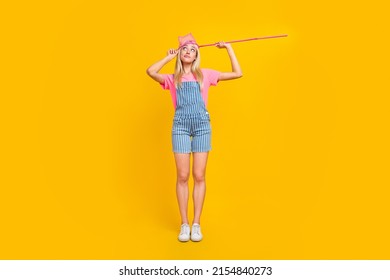 Full Body Portrait Of Minded Clueless Girl Net Head Look Interested Empty Space Isolated On Yellow Color Background