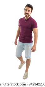 Full Body Portrait. Nice Man Walking. Beautiful And Bearded Person. He Is Wearing A Magenta Polo Shirt And Shorts Jeans. White Background, Isolated.