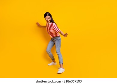 Full body portrait of overjoyed lady dancing partying toothy smile isolated on yellow color background - Shutterstock ID 2186369103