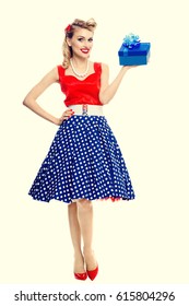 Full Body Portrait Of Smiling Woman Dressed In Pin-up Style Dress With Polka Dot. Caucasian Blond Model Posing In Retro Fashion And Vintage Concept Studio Shoot.